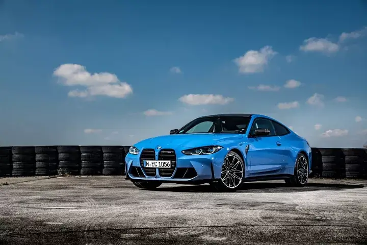 Blue saloon car parked outdoors